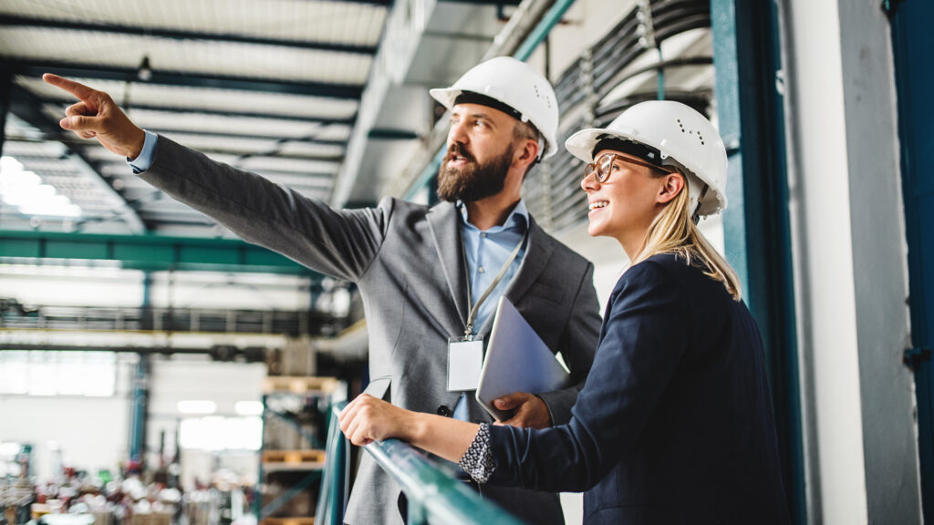 Industrial executives visiting an manufacturing plant